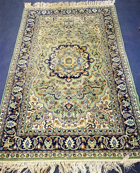 An Indian green carpet 196 x 124cm